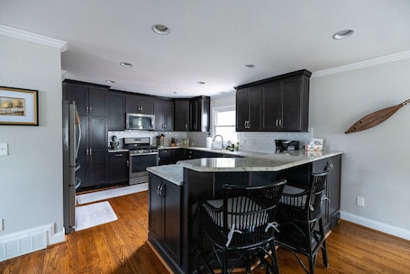 Fridge, microwave, oven, stovetop. The Nola House- Starmount Neighborhood