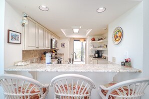 Fridge, microwave, oven, stovetop - Barefoot 217-Second Floor Direct Oceanfront Condo (St. Augustine)