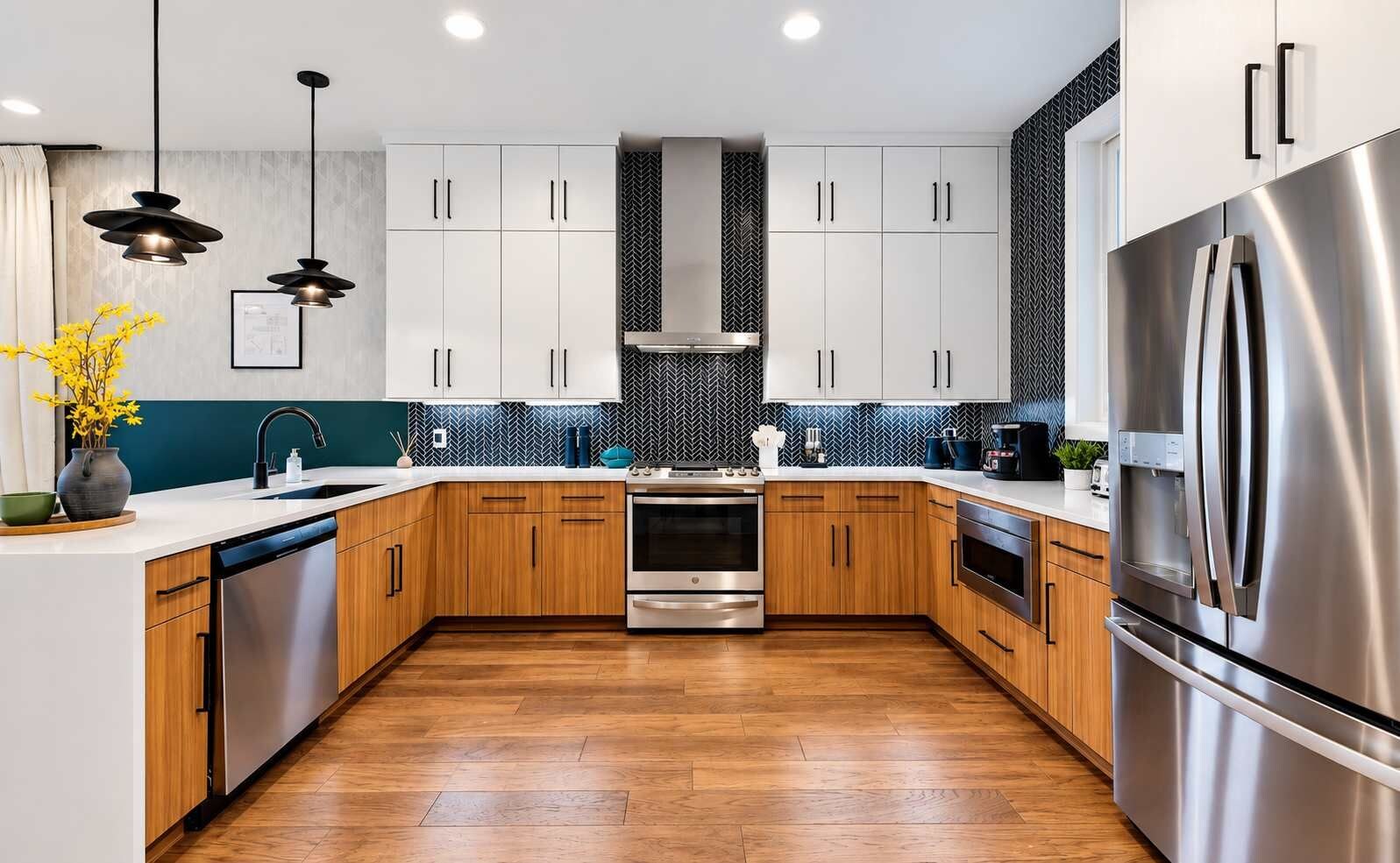 A modern kitchen with wooden cabinets, stainless steel appliances, and a herringbone tile backsplash.