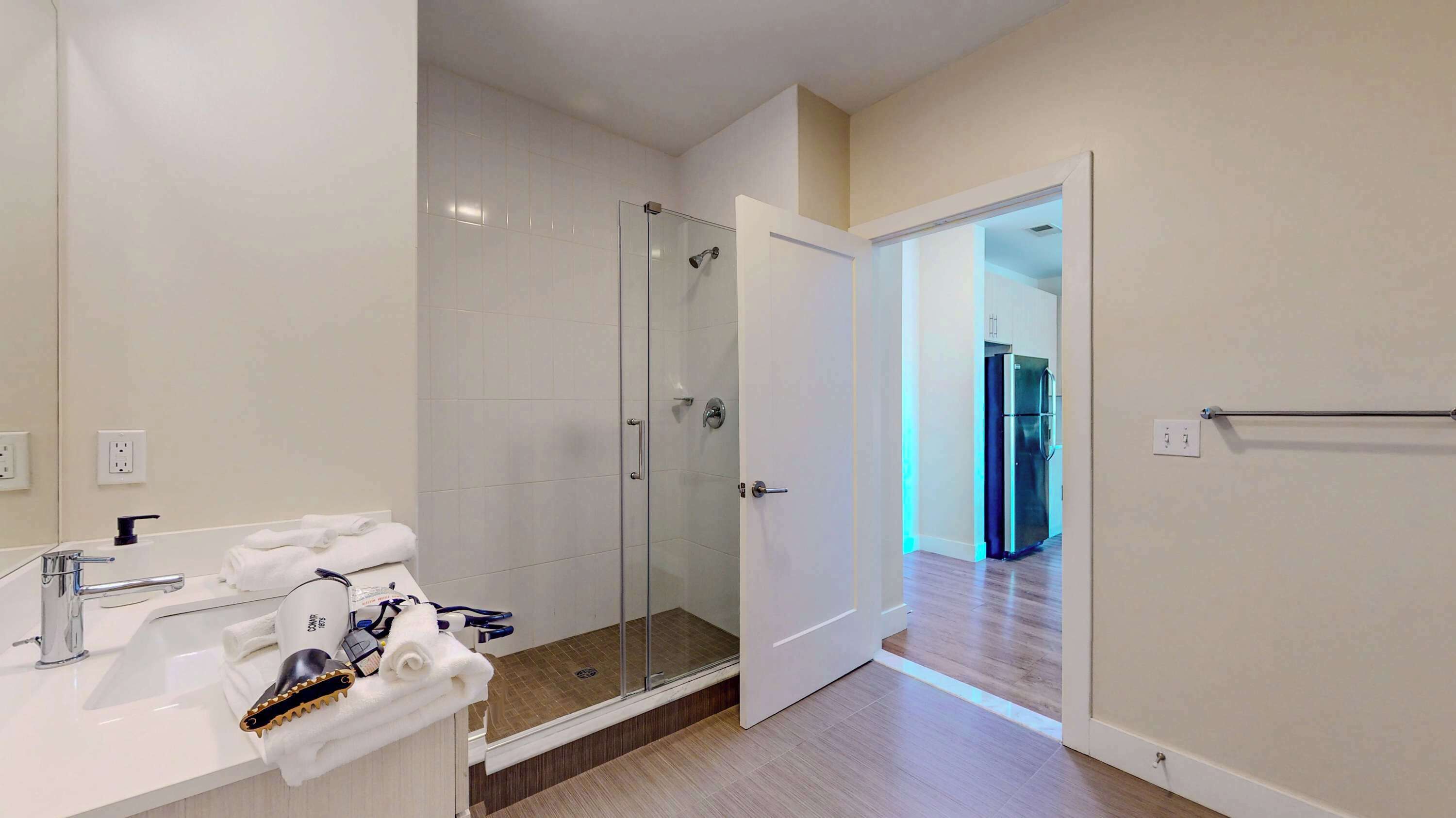 Shower, hair dryer, towels, shampoo
