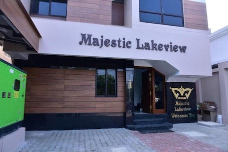 A building with a sign reading "Majestic Lakeview" and a welcoming sign below it.