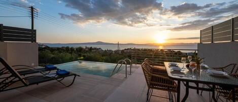 Suite, Balcony, Sea View | Pool | Seasonal outdoor pool, pool loungers