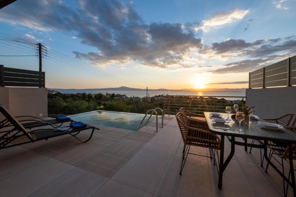 Suite, Balcony, Sea View | Pool | Seasonal outdoor pool, sun loungers