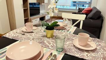 Apartment, City View | Living area | Flat-screen TV
