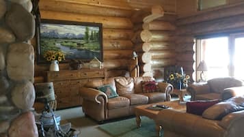 Deluxe Cabin, Lake View | Living area | TV, fireplace, DVD player