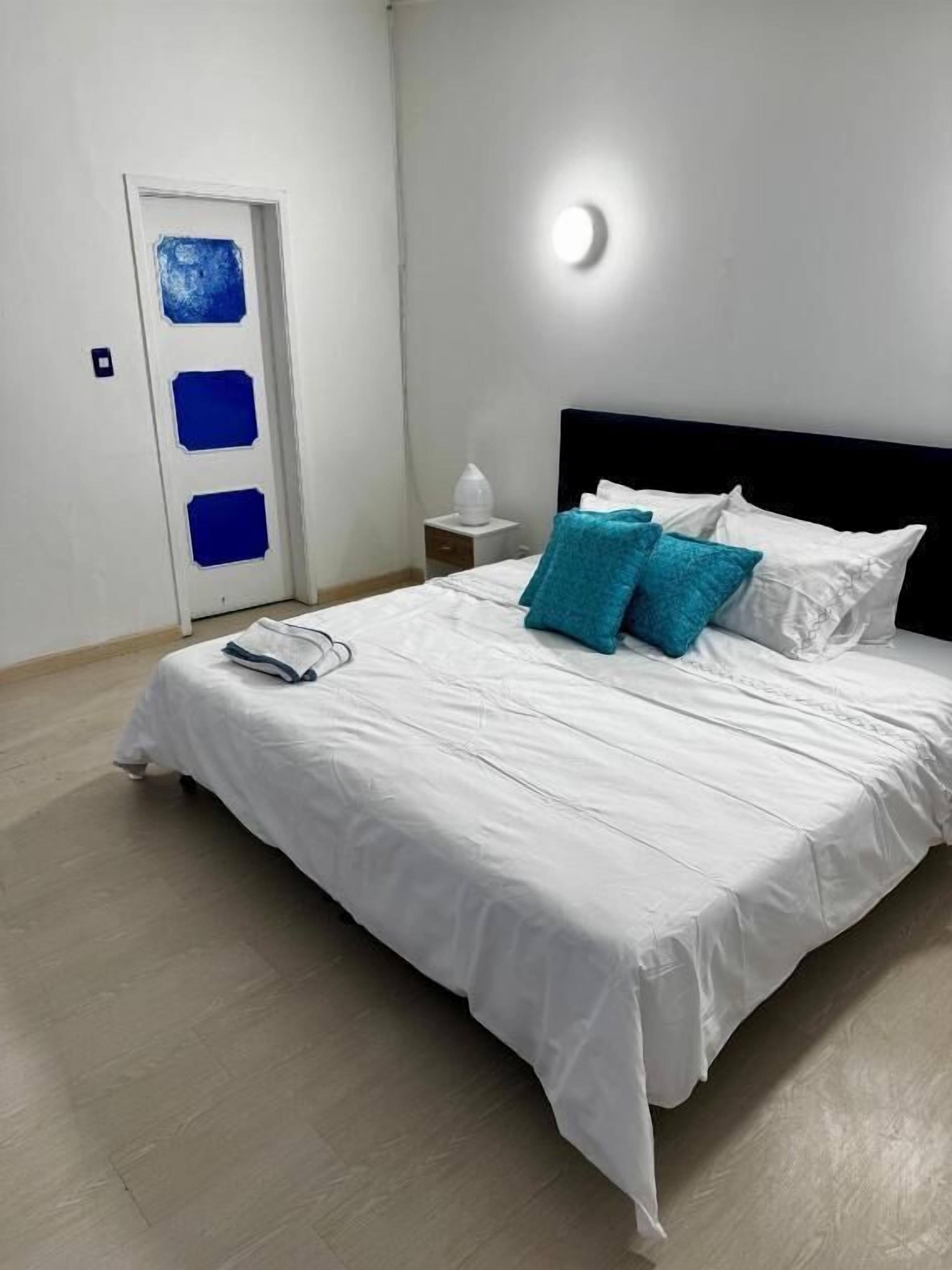 Deluxe Double Room, Courtyard View | Iron/ironing board, free WiFi