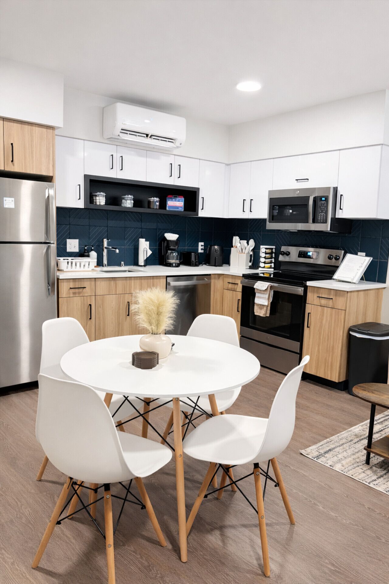 Fridge, stovetop, dishwasher, coffee/tea maker