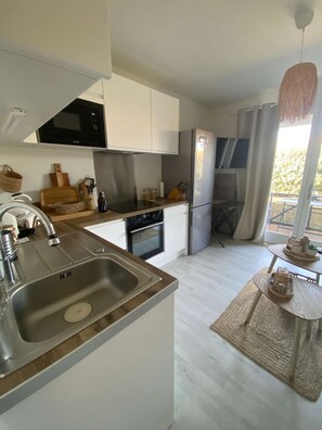 Fridge, microwave, cookware/dishes/utensils