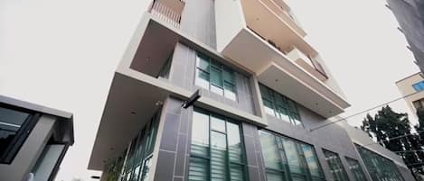 A modern building with large windows and a flat roof.