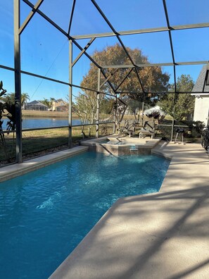 Outdoor pool, a heated pool - Tranquil 4-bedroom house on the lake with amazing sunset views. (Kissimmee)