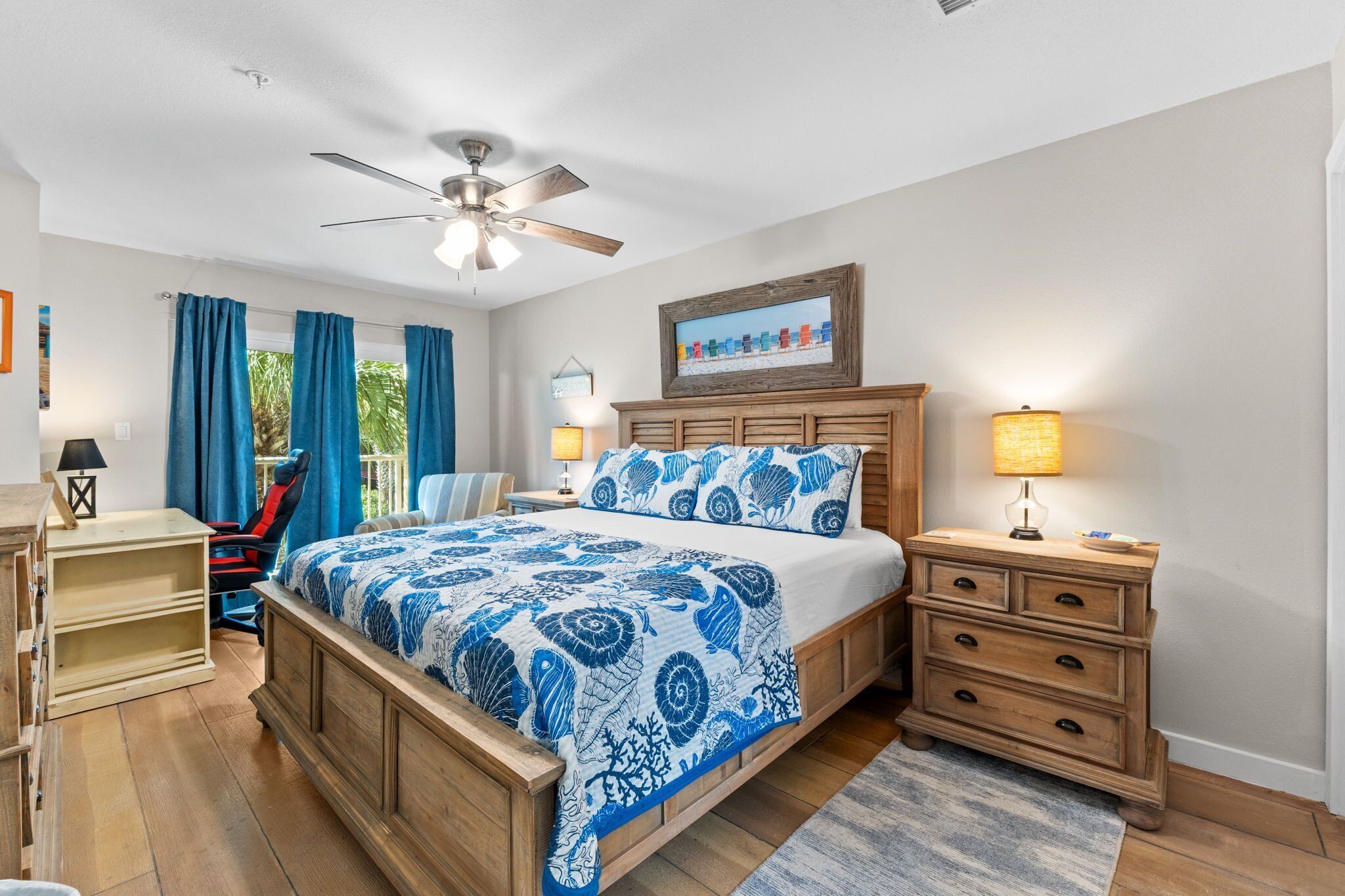 King Master Bedroom with dedicated workspace, balcony access, and attached full bathroom.
