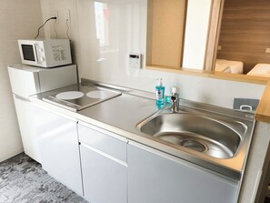 Suite, City View | Private kitchen | Mini-fridge, microwave, stovetop, cookware/dishes/utensils - WELLSTAY Namba Apartmenthotel-Cocochill (Osaka)