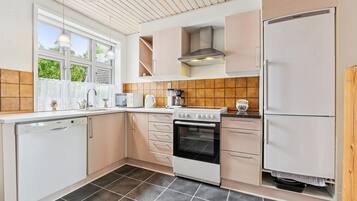 Fridge, stovetop, dishwasher, coffee/tea maker