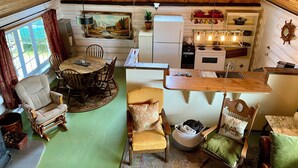 Acogedor interior de cabaña con comedor, cocina y zona de estar.