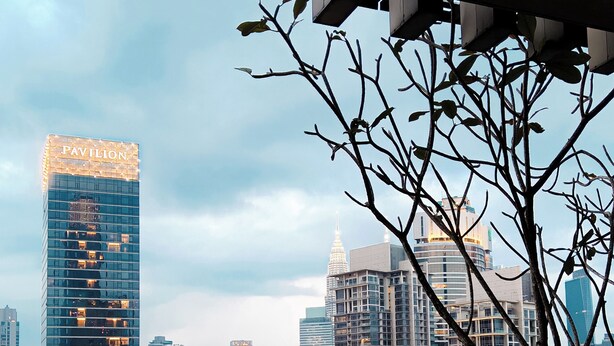 A rooftop pool with a cityscape view, including a building labeled 'Pavilion'. - Axon Residence Bukit Bintang by Fie (Kuala Lumpur)