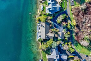 Aerial view - Waterfront home with private hot tub, game room with game tables, and water toys (Gig Harbor)