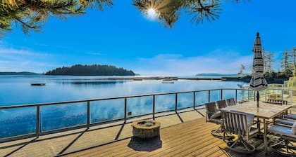 Waterfront home with private hot tub, game room with game tables, and water toys