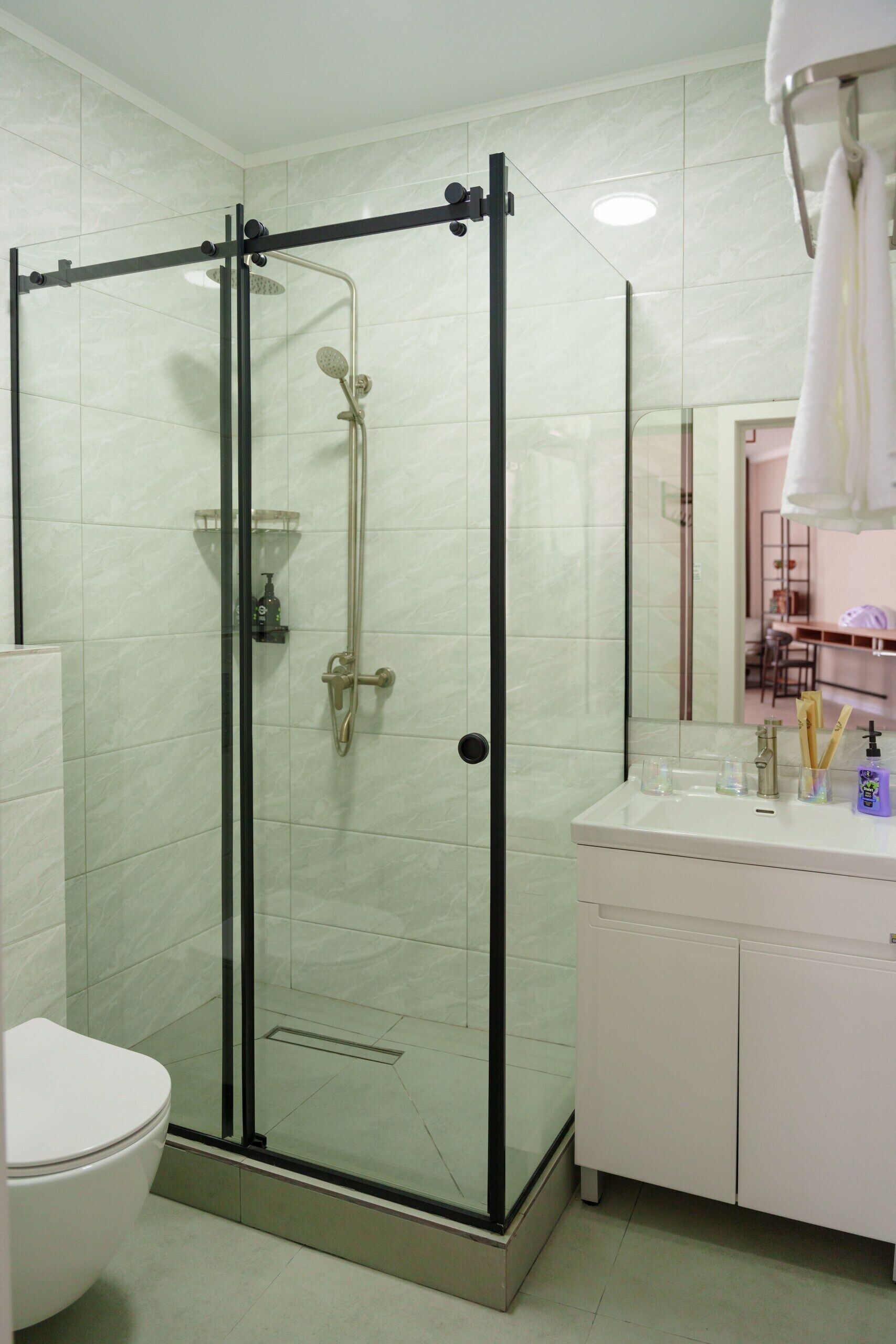 Family Triple Room, Lake View | Bathroom | Shower, hair dryer, slippers, towels