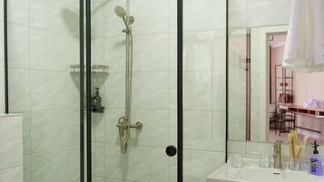 Family Triple Room, Lake View | Bathroom | Shower, hair dryer, slippers, towels