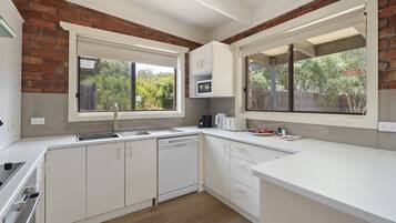 Apartment | Private kitchen | High chair, cookware/dishes/utensils, cleaning supplies