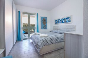 1 bedroom, iron/ironing board - GuestHost - A comfortable and welcoming 55 square meter apartment, perfect for two people, located on the ground floor of a modern condominium with a shared pool in the beautiful town of Palau, ideal for enjoying a relaxing stay.The property is located a (Palau)