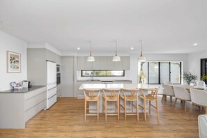 Fridge, microwave, oven, stovetop - Bright Beachside Family House with Ocean Views (Coolum Beach)