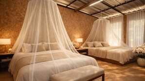 A bedroom with two beds, each with a canopy, wooden headboards, bedside tables with lamps, and a bench.