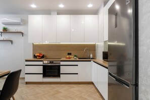 Classic Apartment, Balcony | Private kitchen | Electric kettle