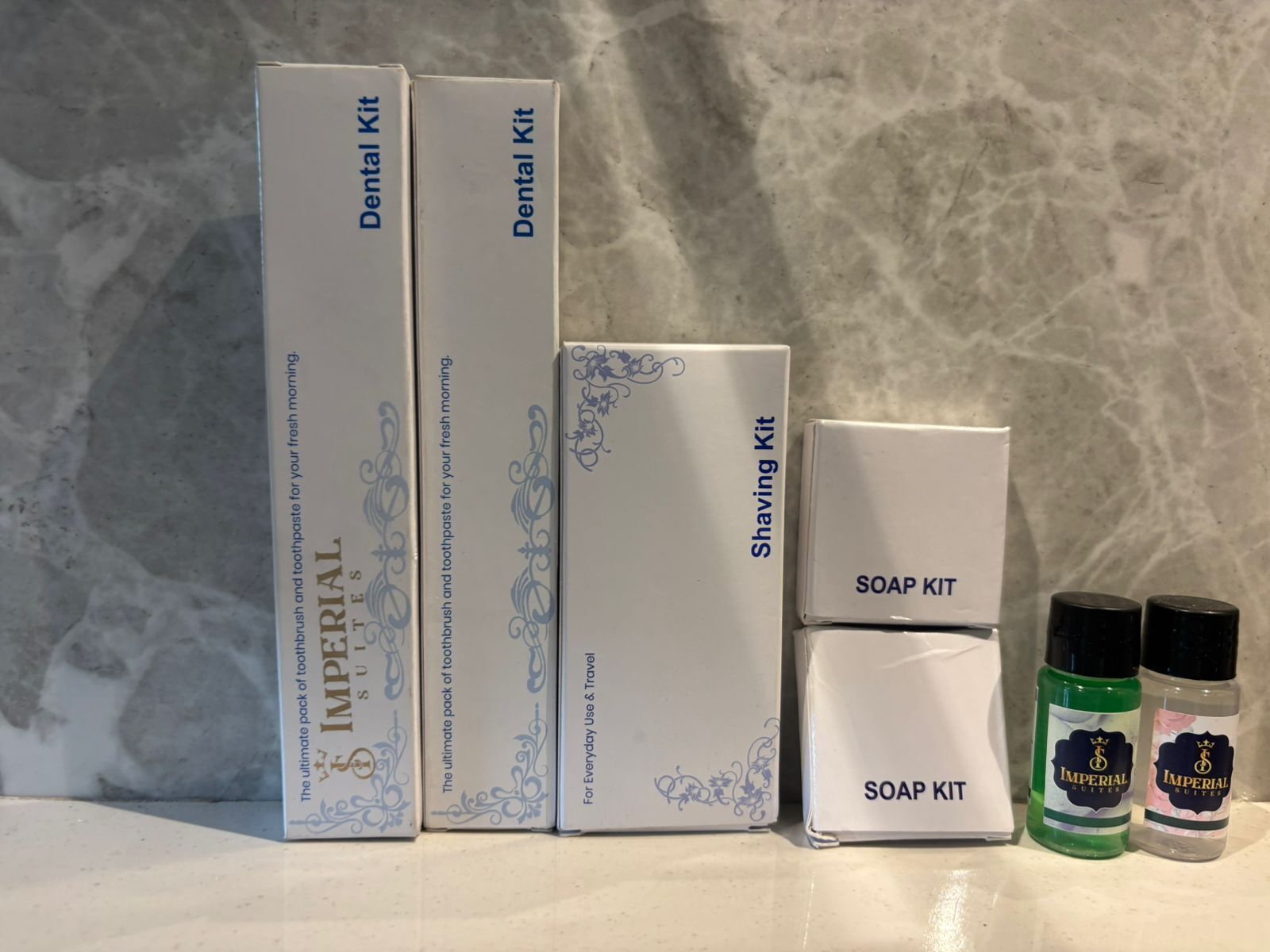 Three boxes labeled 'Dental Kit' and 'Shaving Kit', and two bottles of soap labeled 'Imperial Suites'.