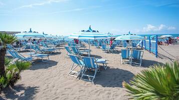 Private beach nearby, black sand, sun loungers, beach umbrellas
