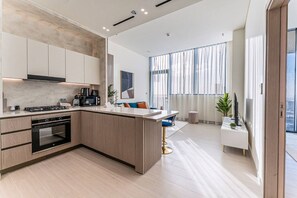 Coffee/tea maker, fridge, microwave, oven - HAVN- High floor 1-bed in Binghatti Royale, JVC (Dubai)