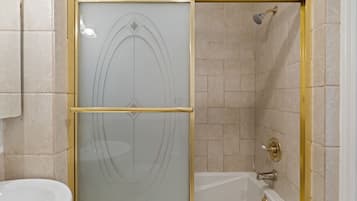 Shower, hair dryer, towels, shampoo