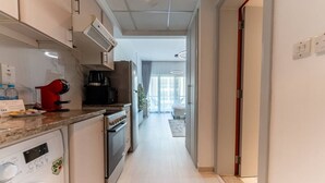 Coffee/tea maker, fridge, microwave, oven - HAVN - Studio Apartment in Ghozlan, The Greens (Dubai)