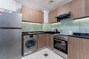 Fridge, microwave, oven, stovetop - HAVN - Studio Apartment infront of CircleMall, JVC (Dubai)