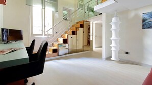 A modern interior with a staircase, a dining area, and a unique white sculpture. - MARGUTTA LOFT FOR SMART WORKER (Roma)