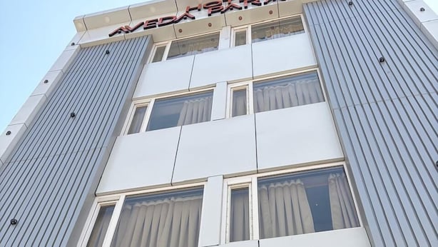 A hotel sign with 'Aveda Paradise Hotel & Restaurant' written on it. - Hotel Aveda Paradise (Varanasi)