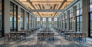 A conference room with a long table and chairs, large windows, and a patterned carpet. - The Residency Signature Madurai (Madurai)