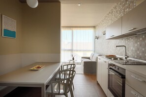Apartamento superior | Zona de estar | Una televisión