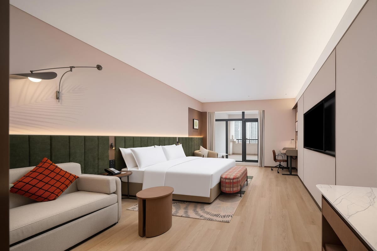 Habitación, 1 cama King size y sofá cama | Área de sala de estar