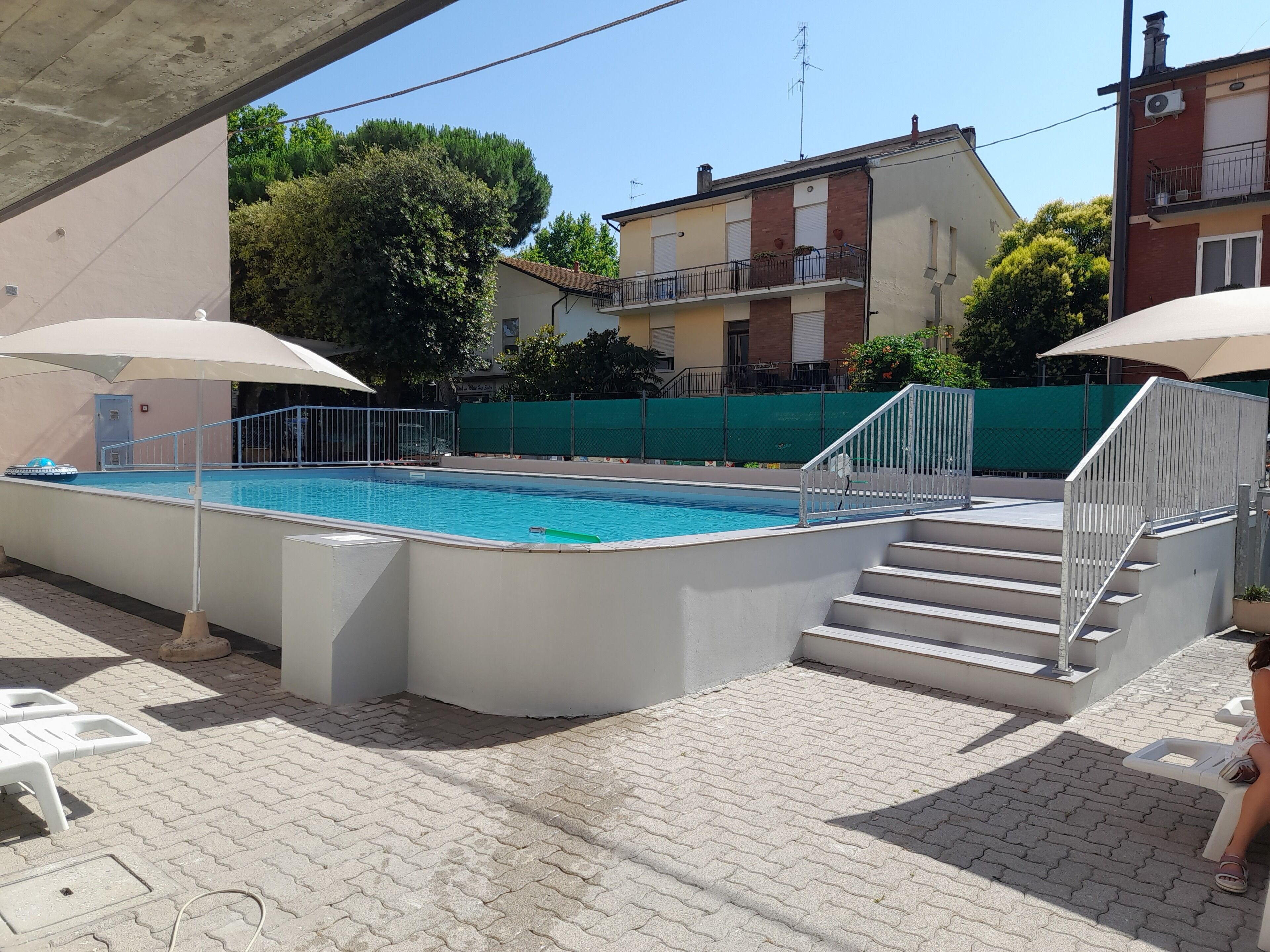 Seasonal outdoor pool, open 9:00 AM to 9:00 PM, pool umbrellas