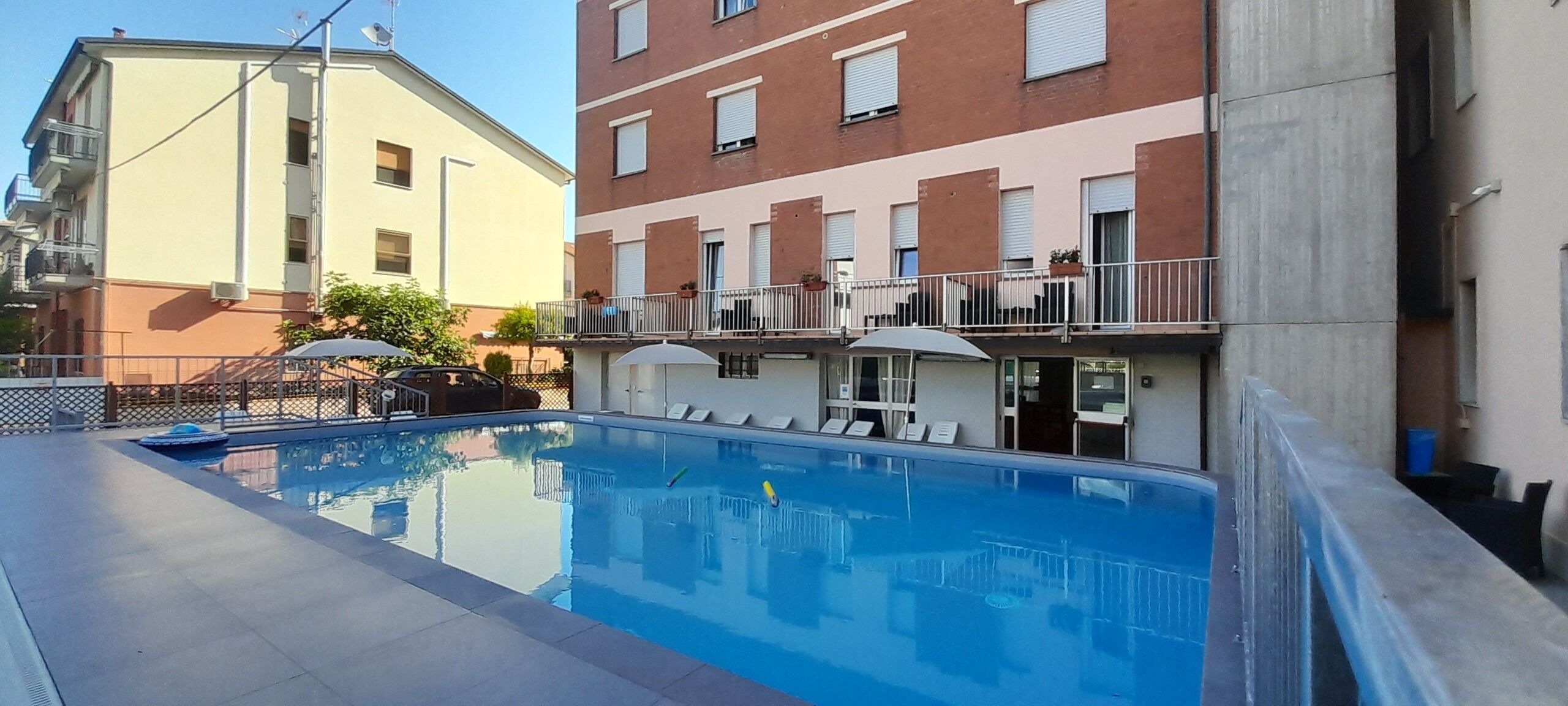 Seasonal outdoor pool, open 9:00 AM to 9:00 PM, pool umbrellas