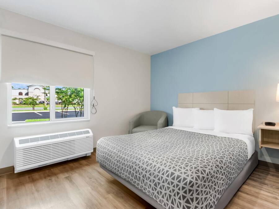 Room, 1 Queen Bed, Roll-in Shower, Non Smoking | Desk, laptop workspace, individually furnished, bed sheets