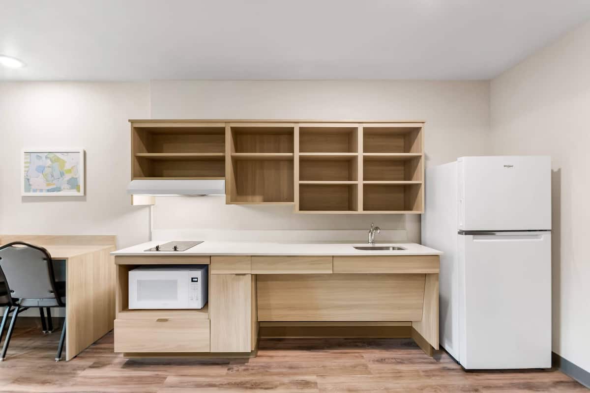 Desk, laptop workspace, individually furnished, bed sheets