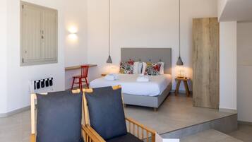 Junior Suite | Living area | 32-inch flat-screen TV with cable channels