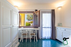 Comfort Apartment | Living area | 35-inch TV with satellite channels