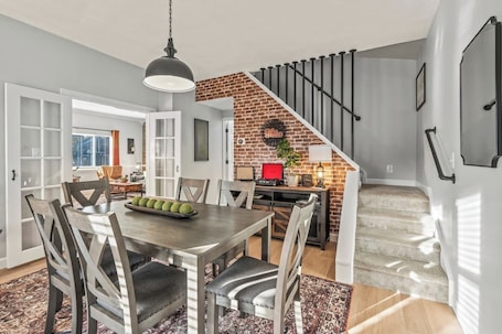 Dining. 5-star, locally owned home in Troy. Private fenced yard, fire pit, BBQ, fully stocked kitchen.