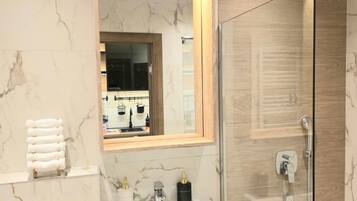 Shower, hair dryer, towels, soap