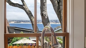 A window with a view of a beach and trees. - 3999 Stay at "Cottage by the Sea" in Monterey (Monterey)