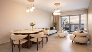 A modern living room with a round dining table, sofas, and a hanging chair. - 2 BR Apartment in Savyoney Tower (w/ safe room) (Jerusalem)