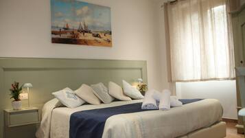 Comfort Room, 1 Bedroom, Ensuite, Courtyard View | Minibar, desk, laptop workspace, free WiFi